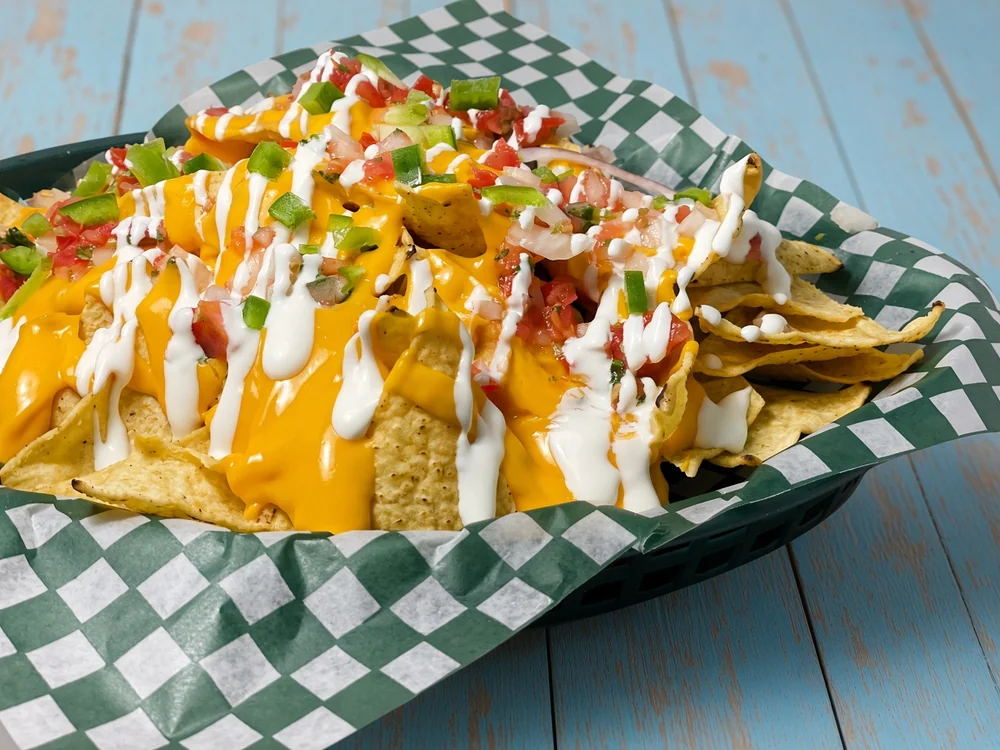 Nachos with melted cheese, pico de gallo and sour cream at JC's Tacos and More in Winnipeg